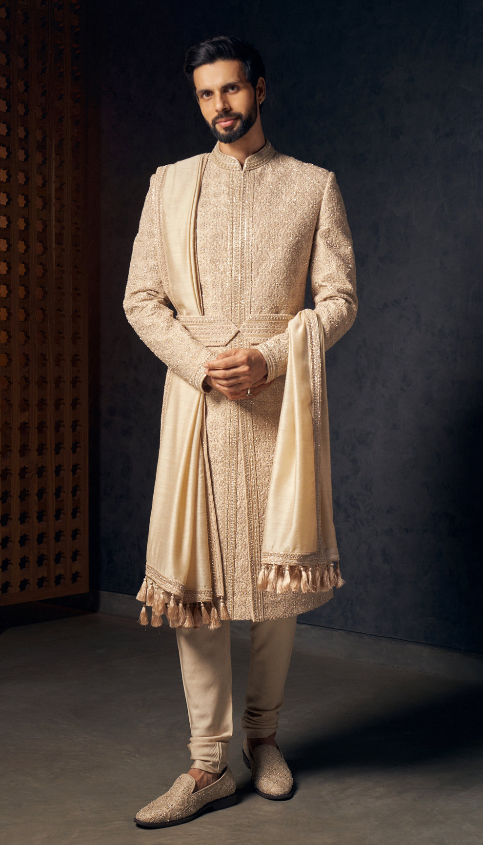 An almond beige raw silk sherwani with delicate tone-on-tone embroidery,