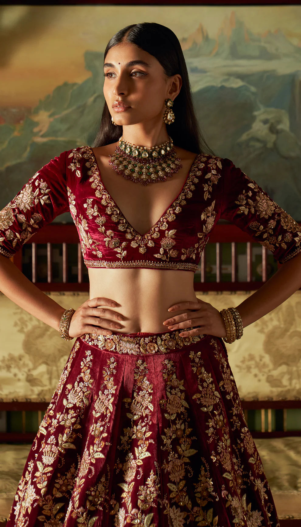 Wine, velvet lehenga, lotus motifs, embroidered, rose gold zardozi, matching choli, tulle net dupatta, trailing head veil, wine bridal lehenga, weddings, festive celebrations, evening receptions
