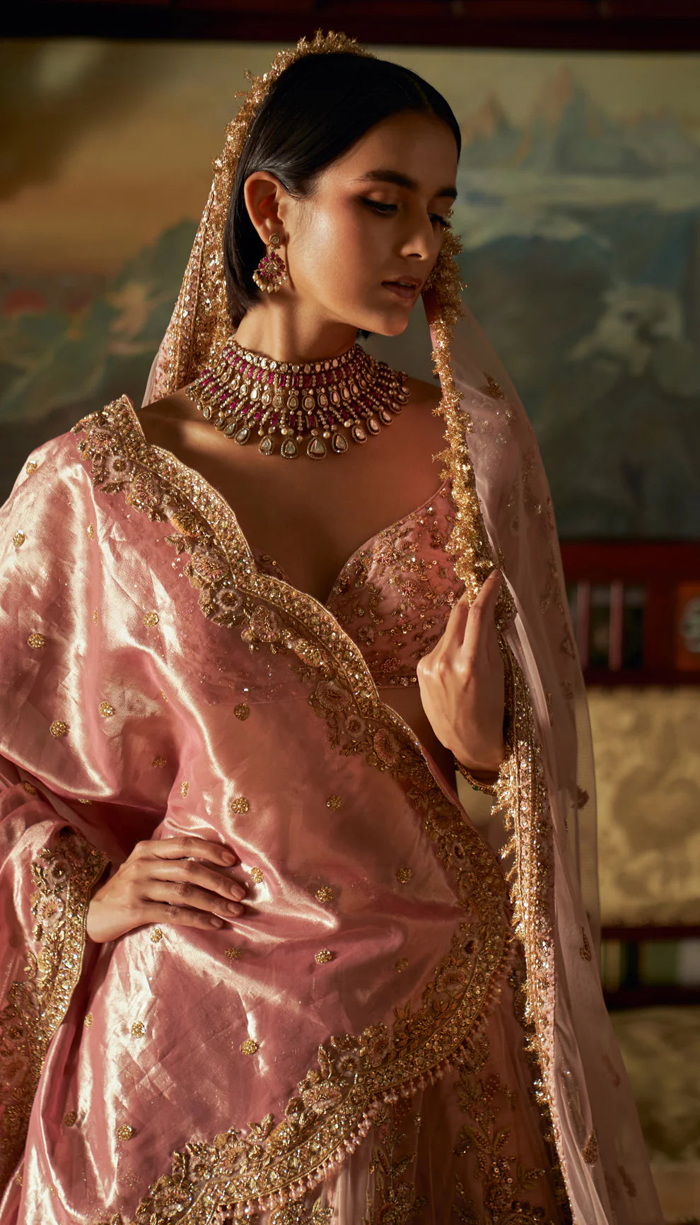 Vintage rose, tulle net lehenga, gold zardozi embroidery, fine jaali pattern, Rajasthani miniatures, cut- away hem choli, sheer tulle net dupatta, soft tissue head veil, light pink bridal lehenga, weddings, festive celebrations, evening receptions